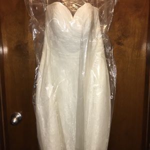 Brand new wedding dress never worn! Still has tags